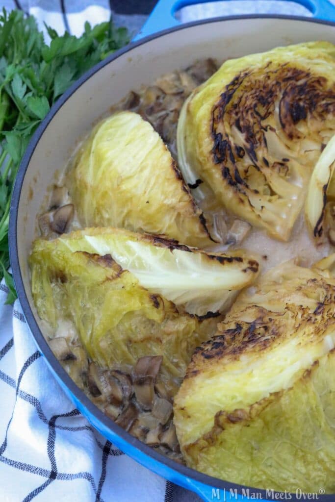 Cooked cabbage with mushrooms in pot