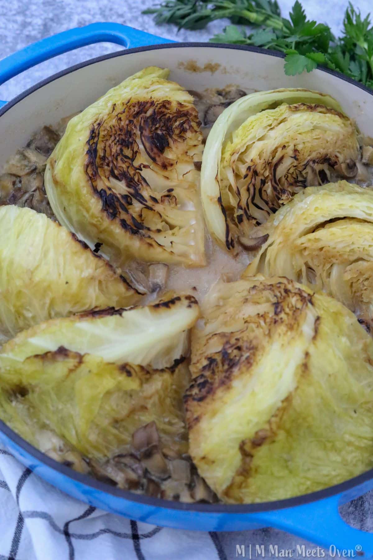 Cooked melting cabbage in a blue pot