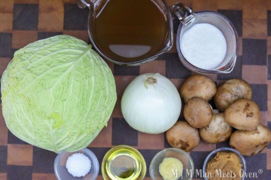 Ingredients for melting cabbage on a wooden cutting board