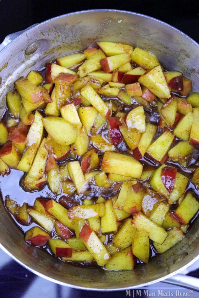 Cooked peaches in syrup and spices.