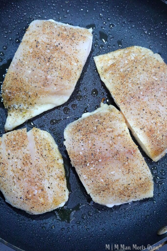 Four pieces of seared halibut fillets