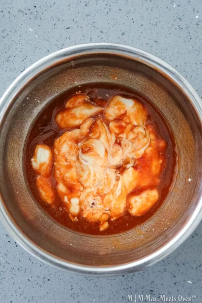 Sauce mixed with salmon pieces.