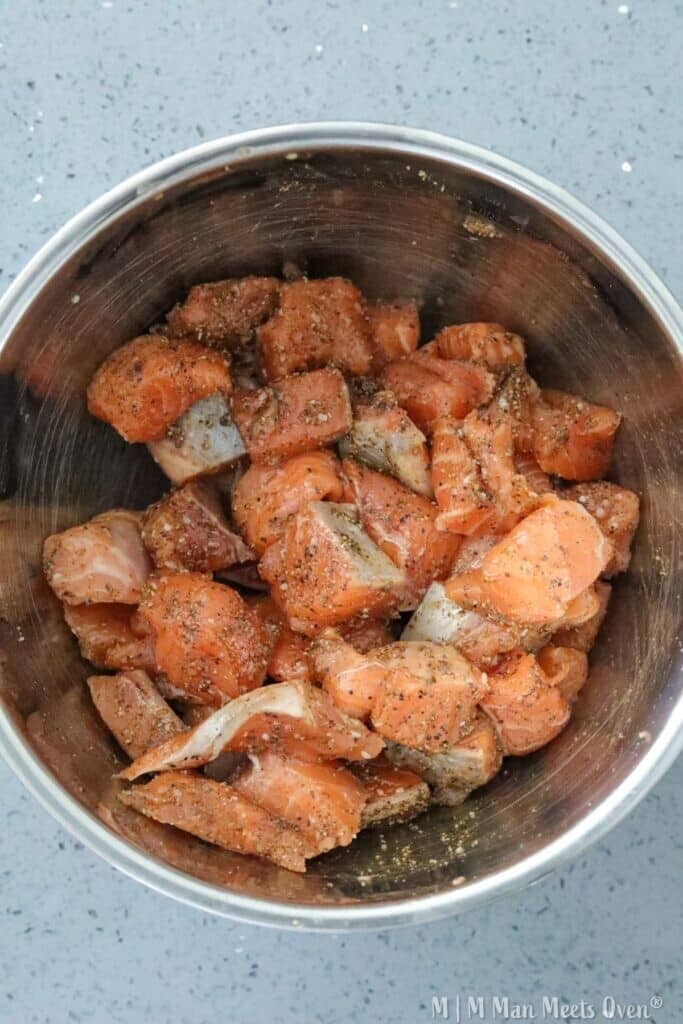 Raw salmon pieces in a bowl