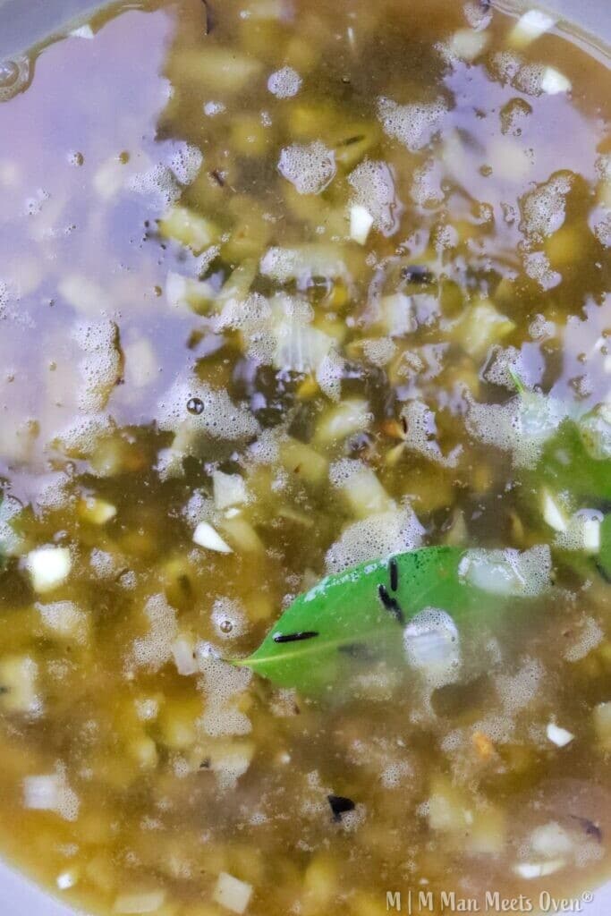 Green broth with vegetables and herbs