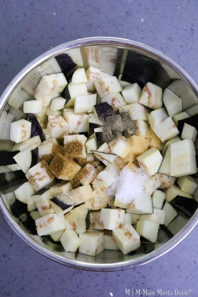Diced eggplant with spices in bowl