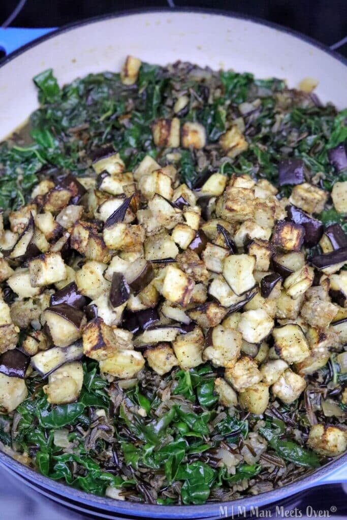 Cooked eggplant with kale and rice