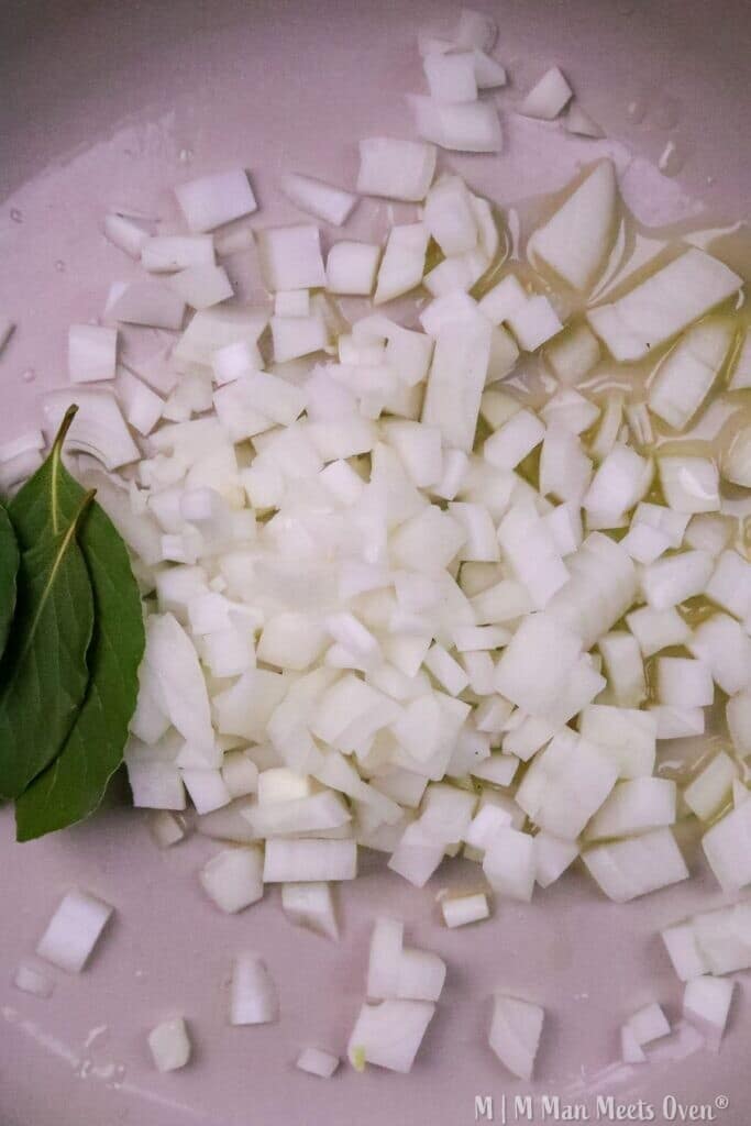 Chopped onions with bay leaves.