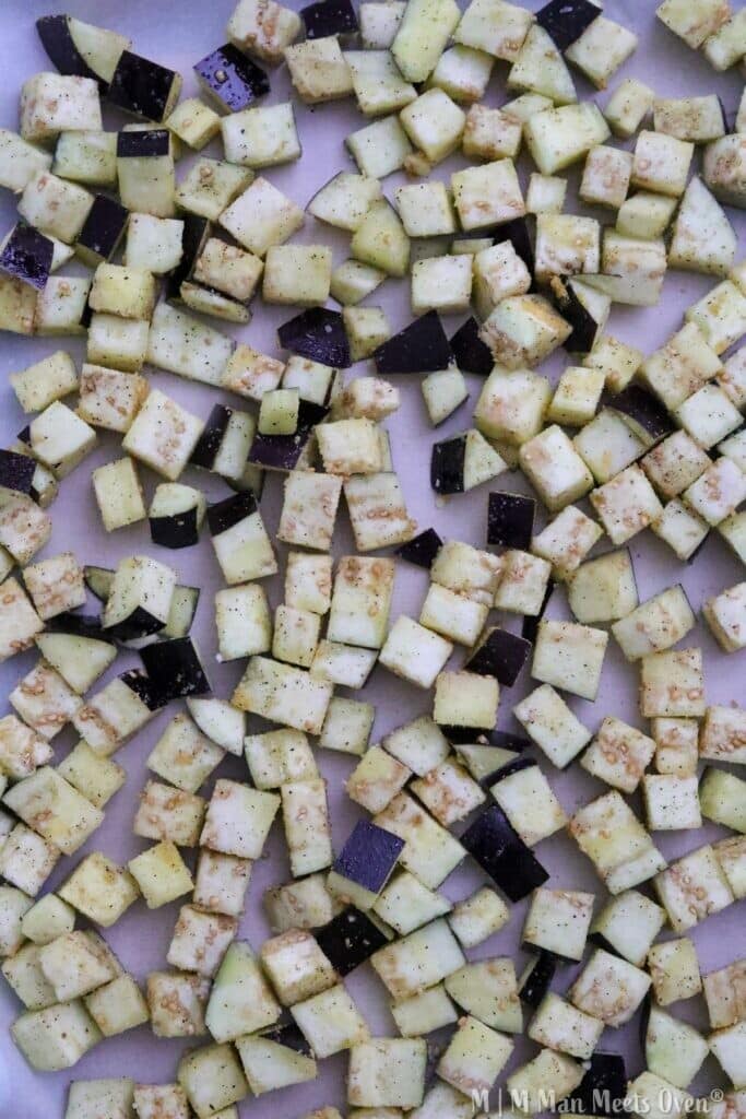 Chopped eggplant pieces on baking sheet.